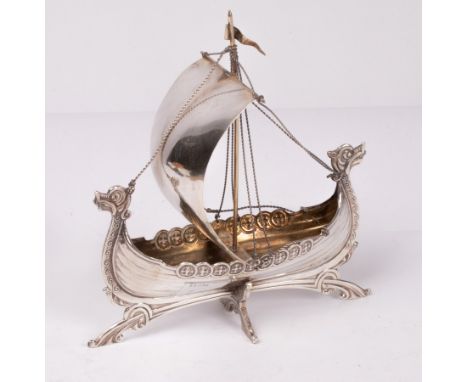 A Norwegian .830 standard silver model of a longboat, Brodrene Lohne, 15cm long x 17cm high, approximately 116g and a scent b