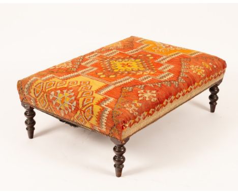 A Kilim upholstered stool on turned legs, the seat 112cm x 75cm   CONDITION REPORT:  Upholstery with some stains to edges. Tu