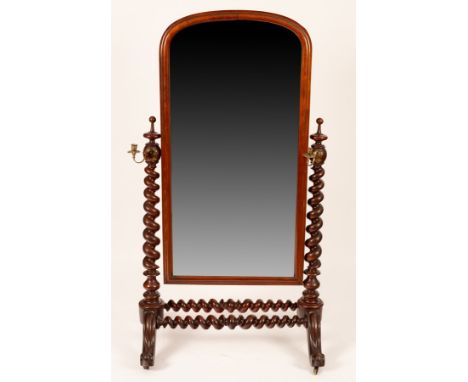 A mahogany cheval mirror, 19th Century, with candle sconces, on turned supports on scroll feet, 159cm high x 85cm wide    CON