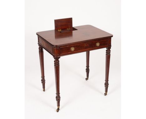 A Regency mahogany chamber writing table, attributed to Gillows, on turned legs with castors, 67cm wide x 74cm high x 51cm de