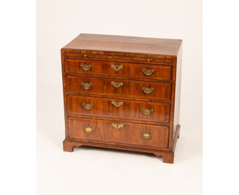 A George III walnut chest, the top crossbanded and fitted four drawers with brushing slide, having brass handles and key hole