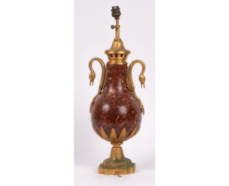 A French rouge marble and gilt metal urn turned table lamp, decorated with swan neck handles, on a quatrefoil base, approxima