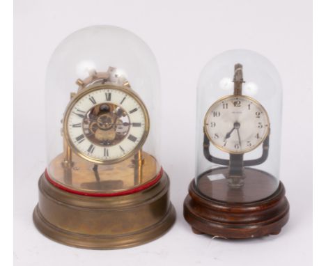 A Eureka brass pillar mantel clock with electric oscillating movement, under a glass dome, 31cm high and another electric gla