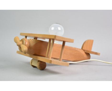 A Novelty Wooden Table Lamp in the Form of a Bi-Plane, 33cms Long