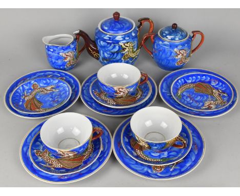 An Oriental Tea Set Decorated with Dragon in Multicoloured Enamels on Blue Ground to Comprise Teapot, Lidded Sugar, Jug, Five