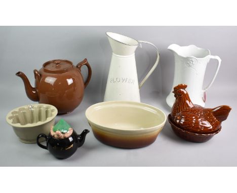 A Collection of Various Kitchenwares to include Large Treacle Glazed Teapot, Egg Crock, Jelly Mould, Wade Andy Capp Teapot, T