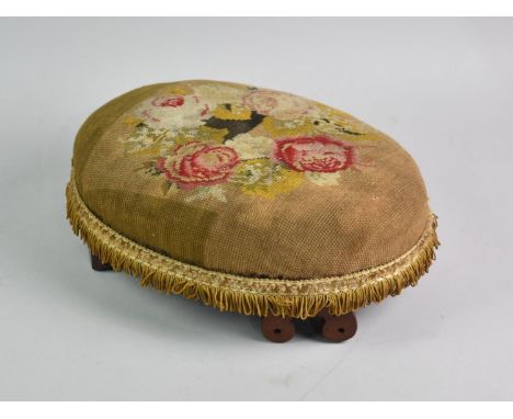A Late Victorian Oval Tapestry Upholstered Footstool with Scrolled Feet, 34cms Wide