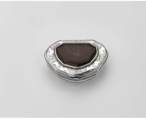 A GEORGE II SILVER SNUFF BOX cartouche-shaped with reeded borders, the cover with chased border work and an inset panel of ag