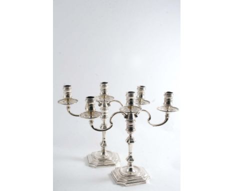 A PAIR OF LATE 20TH CENTURY CAST THREE- LIGHT CANDELABRA in the early 18th century style on square bases with incurved corner
