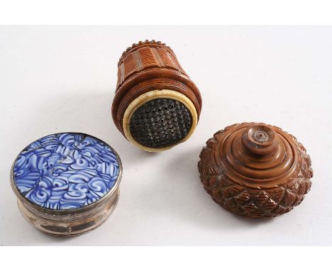 AN EARLY 19TH CENTURY TURNED COQUILLA NUT NUTMEG GRATER with a screw cover and a lift-out tinned steel grater together with a