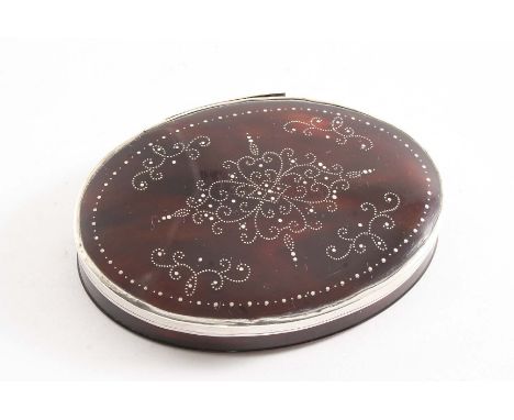 AN EARLY 18TH CENTURY MOUNTED TORTOISESHELL OVAL SNUFF BOX with a pique-work design on the cover, unmarked, 1715-20;  3"  (7.
