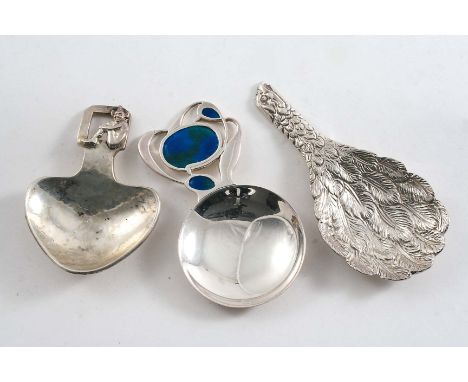 THREE CONTEMPORARY CADDY SPOONS:- An eagle's wing, hallmarked Sheffield 1987, a spoon with an enamelled terminal by Liberty &