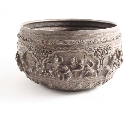 A LATE 19TH / EARLY 20TH CENTURY BURMESE RICE BOWL embossed &amp; chased in relief around the sides with vignettes of figures