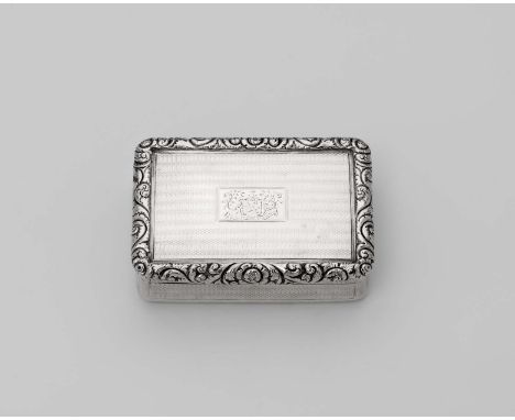 A GEORGE IV SILVER FREEDOM BOX rectangular with engine-turning, the cover with a chased foliate border and engraved central c