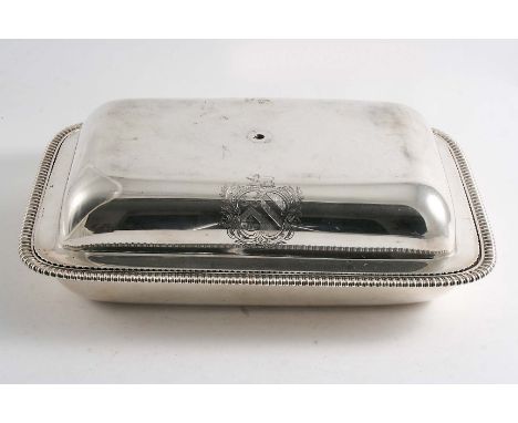 BY PAUL STORR:- A George III rectangular cushion-shaped entree dish & cover with gadrooned borders and coat of arms engraved 