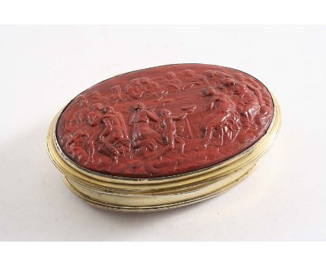 A LATE 18TH CENTURY SILVERGILT OVAL SNUFF BOX with reed borders, slightly concaved sides and a carved jasper plaque inset int