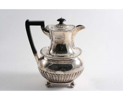 A LATE VICTORIAN PART-FLUTED HOT WATER JUG with gadrooned borders, an angular handle and ball feet, by R. Martin & E. Hall, S