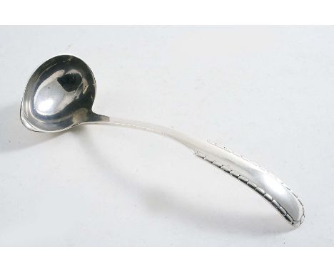 BY GEORG JENSEN:- A Danish, rope pattern sauce ladle with English import marks for London 1928;  5.5"  (14 cms) long;  0.8 oz