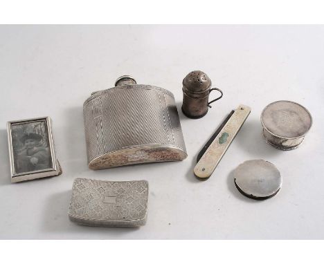 A MIXED LOT:- A spirit flask, inscribed, a George III unmarked snuff box, two small circular boxes, a small pepperette, a sma