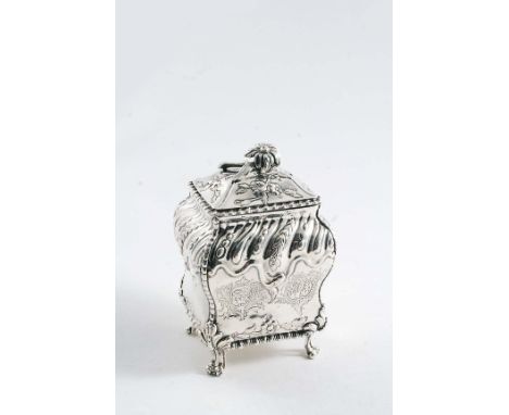 AN EARLY GEORGE III EMBOSSED TEA CADDY of bombe form on four scroll feet with a domed cover & flower finial, engraved with tw