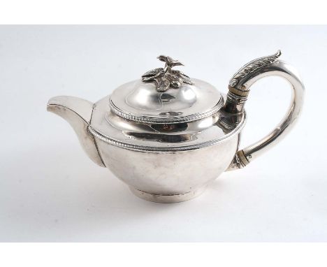 A GEORGE III CIRCULAR TEA POT on a collet foot with gadrooned borders, a detachable cover & a later plated finial by either J