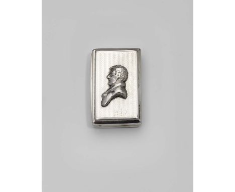 AN EARLY VICTORIAN SILVER SNUFF BOX rectangular with engine-turned decoration and concaved reeded sides, the cover set with a