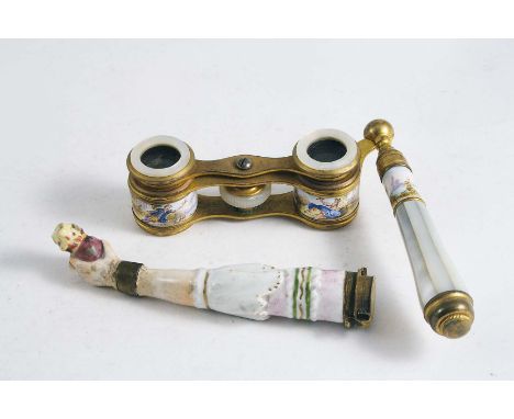 A PAIR OF OPERA GLASSES with enamel & gilt metal frames and a porcelain needle case in the form of an arm clutching a heart