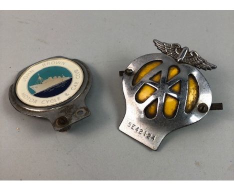 NOVELTY INKWELL IN THE FORM OF A HELMET, on a rectangular base; along with a set of writing accessories carved to depict fema