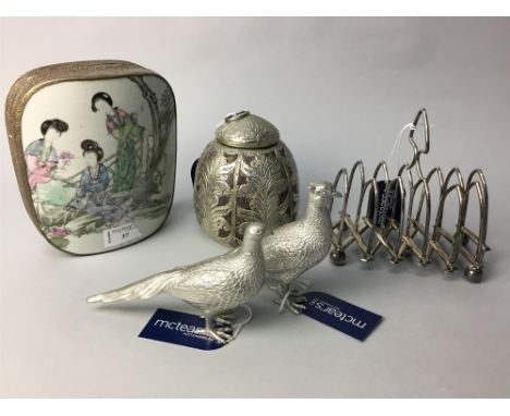 A CHINESE WHITE METAL TRINKET BOX, the cover inset with a ceramic panel; along with a metal tea caddy, an expandable toast ra