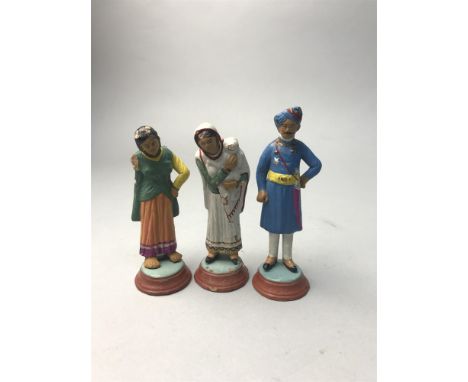 LOT OF FIGURES IN INDIAN DRESS, including examples modelled in military uniform and traditional dress, along with accompanyin