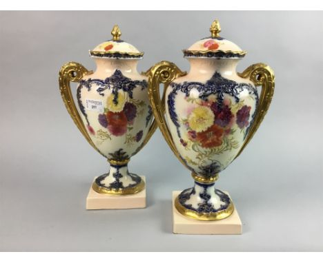PAIR OF TWIN HANDLED CERAMIC VASES, with floral and gilt detail