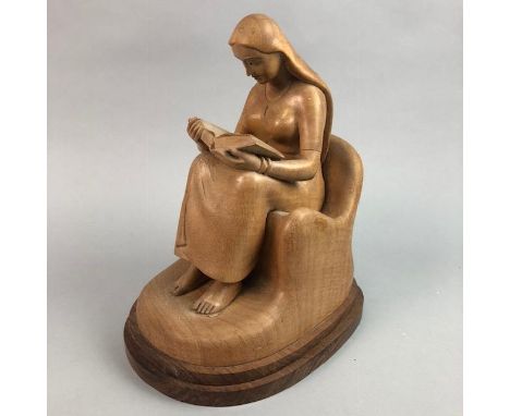 CARVED WOODEN FIGURE OF A SEATED WOMAN, modelled reading; along with a Royal Doulton figure, two Nao figures and a Lladro fig