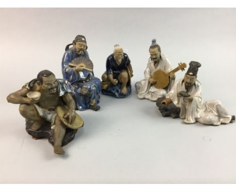 NINE CHINESE GLAZED CERAMIC SEATED FIGURES, modelled in various activities such as playing instruments and writing