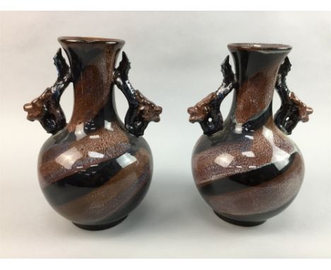 PAIR OF CHINESE GLAZED DOUBLE HANDLED VASES, along with a ceramic pillow of a foe dog and a censor