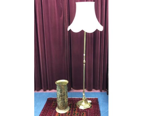 BRASS STANDARD LAMP, with shade; along with a brass embossed stick stand (2)