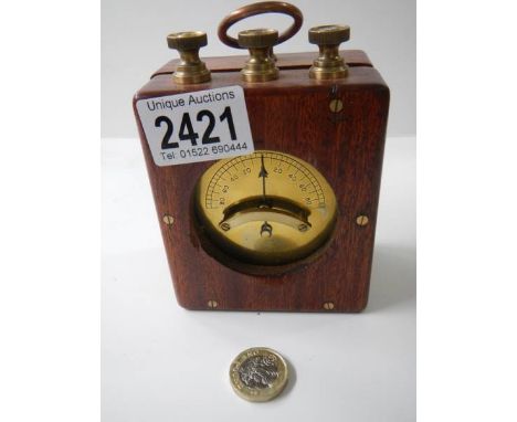 A portable vetical differential galvanometer in wooden case, circa 1920.