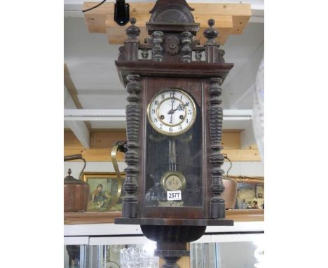 A Victorian mahogany wall clock in working order. COLLECT ONLY.