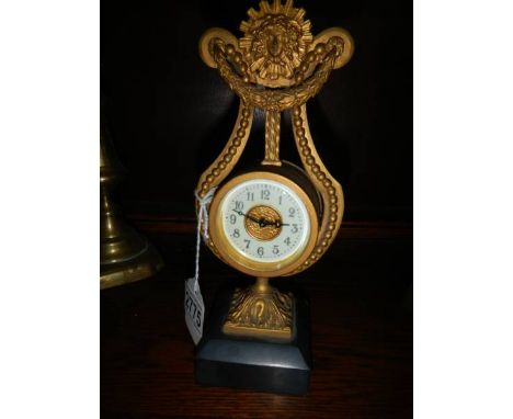An old brass lyre shaped clock, a/f.