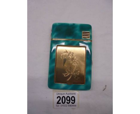 An unusual retro combination cigarette case, lighter and powder compact, looks unused.