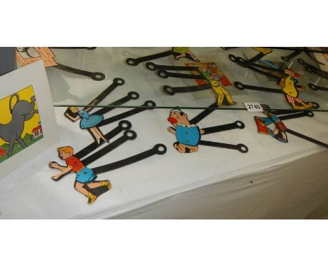 A collection of old move-able 'Magic Lantern' figures.