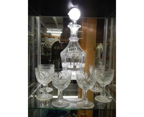 A cut glass decanter and six glasses.All pieces in good condition