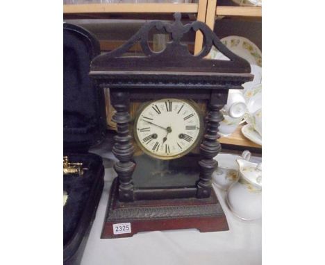 A good working mantel clock complete with key.