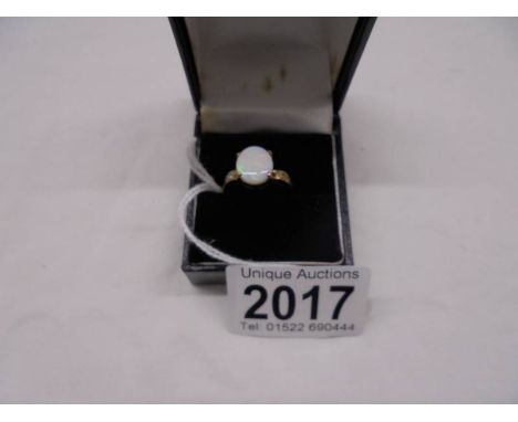 A yellow gold ring set large opal, size Q, 3.3 grams.Opal size 12mm x 10mmNo Hallmark