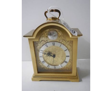 A heavy brass Swiss made clock. in working order.