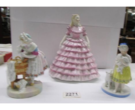 A Coalport Ladies of Fashion figurine 'First Dance', A match striker and another figure both with faded crossed swords marks.