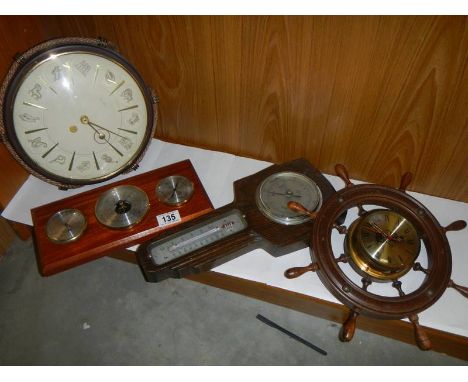 Three barometers and a clock.