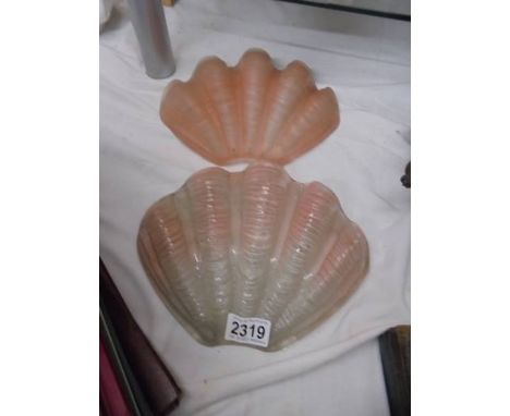 Two art deco pink glass clam shell Odeon wall light shades.