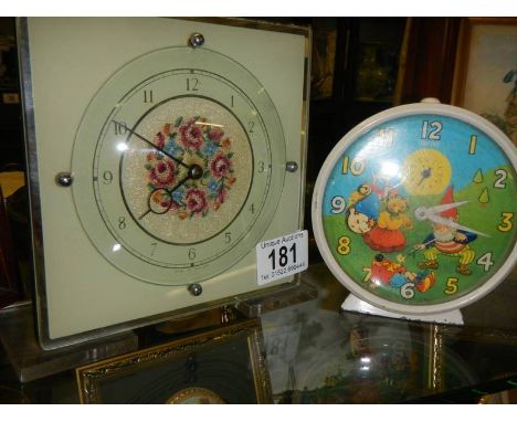 A Noddy clock and one other.