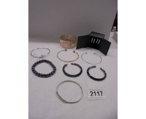 A sterling silver bangle, 4 other bangles, a bracelet, a pair of hoop earrings and a pair of cuff links.