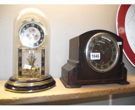 A glass dome painted anniversary clock (needs wire) and a 1930's oak mantle clock COLLECT ONLY